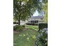 Beautiful backyard with a screened porch, well maintained lawn and landscaping at 7140 N Ridge Dr, Raleigh, NC 27615