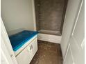 Bathroom featuring a tiled shower-tub combo and a vanity with doors, ready for personalization at 798 Old Station Pointe, Angier, NC 27501
