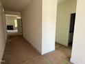 Bright hallway leading into a living area with a fireplace, showcasing the home's open floor plan at 798 Old Station Pointe, Angier, NC 27501