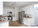 Bright kitchen featuring stainless steel appliances and ample cabinet space at 8701 Erinsbrook Dr, Raleigh, NC 27617