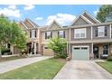 Charming townhome featuring a driveway and attached garage nestled in a well-maintained neighborhood at 103 Ransomwood Dr, Apex, NC 27539