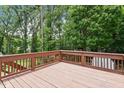 Large wooden deck overlooking a fenced backyard, perfect for outdoor entertaining at 105 Otter Dr, Cary, NC 27513