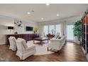 Bright living room boasts hardwood floors, a custom built-in, and lots of natural light at 1120 Hooper Pl, Durham, NC 27703