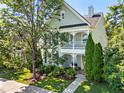 Charming two-story home with covered porch, lush landscaping, and a welcoming entrance at 1201 Somers Dr, Morrisville, NC 27560