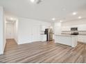 Bright living area offering hardwood floors and an open-concept design, perfect for flexible living at 1212 Solace Way, Rolesville, NC 27571