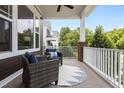 Relaxing porch with comfortable seating overlooking a lush green neighborhood at 1508 Heritage Reserve Ct, Wake Forest, NC 27587