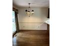 Classic dining room featuring hardwood floors and an elegant chandelier at 2237 Keith Hills Rd, Lillington, NC 27546