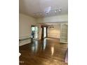 Spacious living room with hardwood floors and a large window at 2237 Keith Hills Rd, Lillington, NC 27546