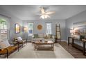 Inviting living room featuring hardwood floors, comfortable seating, and a ceiling fan at 2704 Shaftsbury St, Durham, NC 27704