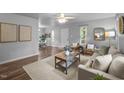 Open living space featuring a comfortable seating area and seamless flow to the dining room at 2704 Shaftsbury St, Durham, NC 27704
