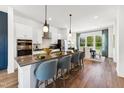 Well-appointed kitchen with a large island, bar seating, and stainless steel appliances at 2808 Kempthorne Rd # 61, Cary, NC 27519