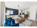 Open-concept living room flows into the kitchen, featuring elegant furnishings and modern decor at 2808 Kempthorne Rd # 61, Cary, NC 27519