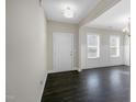 Inviting entryway featuring dark wood floors, white trim, and a bright, airy feel at 32 Iroquois Ct, Garner, NC 27529