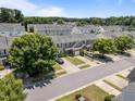 Community aerial view showcasing townhomes with private driveways and a tree-lined street at 3526 Londonville Ln, Raleigh, NC 27604