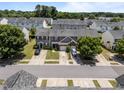 A peaceful street showcasing townhomes, manicured lawns, and convenient parking at 3526 Londonville Ln, Raleigh, NC 27604