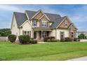 A beautiful house with a manicured lawn and mature landscaping at 5400 Falconton Ln, Raleigh, NC 27610