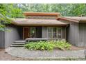 Inviting front entrance features a wooden door and a small porch with brick accents at 6 Womble Cir, Durham, NC 27705