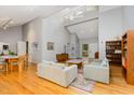 Bright and airy living room with vaulted ceilings, hardwood floors, and large windows at 6 Womble Cir, Durham, NC 27705
