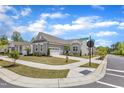 Well-manicured lawn with sidewalk access to a charming single-Gathering home with a two-car garage at 704 Haven Peak Ln, Wake Forest, NC 27587