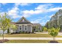 Beautiful home with gray siding, a well-maintained lawn, and lovely landscaping at 704 Haven Peak Ln, Wake Forest, NC 27587