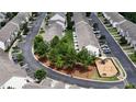 A well-planned community featuring neatly arranged homes, ample parking, and green spaces with a playground at 711 Keystone Park Dr # 78, Morrisville, NC 27560