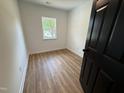 Cozy bedroom with new hardwood floors, fresh paint, and a bright window at 1225 Gay St, Rocky Mount, NC 27804
