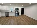 Modern kitchen featuring white cabinets, stainless steel appliances, and a stylish backsplash at 1225 Gay St, Rocky Mount, NC 27804