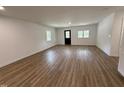Bright living room with hardwood floors and plenty of natural light from the many windows at 1225 Gay St, Rocky Mount, NC 27804