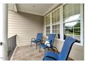 Relaxing front porch with comfortable seating and bright natural light at 218 Kinvara Ct, Wake Forest, NC 27587