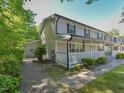 End unit townhome featuring a covered front porch, perfect for enjoying the outdoors at 225 Douglas St, Holly Springs, NC 27540