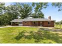 A cozy single-story brick home with a covered carport and inviting curb appeal at 2291 Gentry Ridge Rd, Roxboro, NC 27574