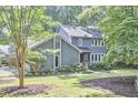 Inviting two-story home with neat landscaping and a well-maintained lawn creates a welcoming atmosphere at 2334 Dawn Trl, Durham, NC 27712