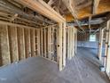 Spacious room with exposed framing, ready for customization and featuring natural light at 29 Chloe Ct, Selma, NC 27576