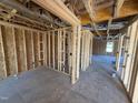 Unfinished living room featuring stud walls and a concrete floor at 29 Chloe Ct, Selma, NC 27576