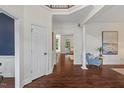 Welcoming foyer with hardwood floors and white trim; leads to other rooms at 3 White Ash Dr, Durham, NC 27712