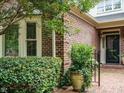 Detailed brickwork and professional landscaping provide this home with undeniable curb appeal at 3339 Ridgecrest Ct, Raleigh, NC 27607