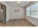 Bright dining area features hardwood floors and a window with natural light at 40 Otter Ct, Youngsville, NC 27596