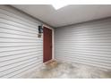 Private condo entrance with a modern door and a cozy welcome mat at 407 Gooseneck Dr # B1, Cary, NC 27513