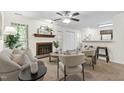 Comfortable living room with a brick fireplace and an open floorplan at 407 Gooseneck Dr # B1, Cary, NC 27513