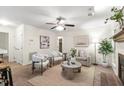 Bright living room featuring neutral tones, ceiling fan and stylish decor at 407 Gooseneck Dr # B1, Cary, NC 27513