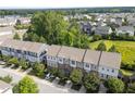Aerial view of townhomes with lush greenery surrounding the neighborhood at 4124 Sykes St, Cary, NC 27519