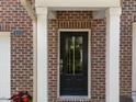 Close-up of the red brick front entrance, showcasing a dark door and white trim at 4124 Sykes St, Cary, NC 27519