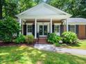 Charming brick home with a columned front porch at 4909 Brookhaven Dr, Raleigh, NC 27612