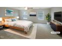 Tranquil bedroom with neutral tones, soft carpeting, and bright windows. (Virtually staged) at 6701 Winding Arch Dr, Durham, NC 27713