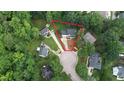 Aerial view of a home in a lush, green, tree-filled neighborhood showing property lines at 9020 Branch Creek Way, Apex, NC 27539