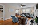 Cozy living room with hardwood floors, comfortable seating, and a decorative fireplace at 9964 N Chestnut St, Middlesex, NC 27557