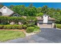 Beautiful brick home with mature landscaping and a private driveway at 104 Cedar Ridge Way, Durham, NC 27705