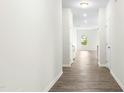 Bright hallway with modern flooring leading into the open living area, enhancing the home's flow at 107 Altair Ln, Sanford, NC 27330