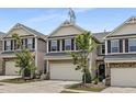 Attractive townhome with a two-car garage, neat landscaping, and pleasing curb appeal at 129 Explorer Dr # 256, Morrisville, NC 27560