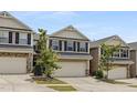 Inviting townhouse features a convenient two-car garage and well-kept front yard at 129 Explorer Dr # 256, Morrisville, NC 27560